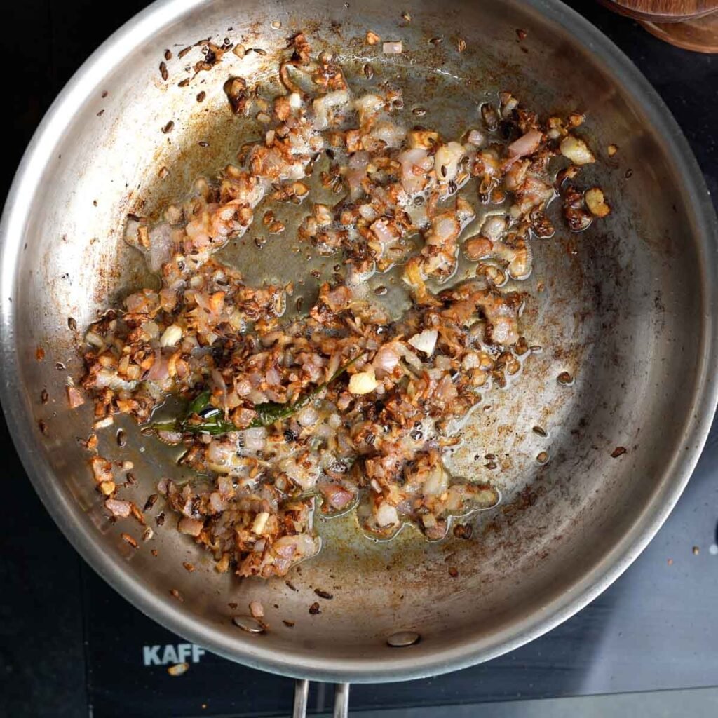 Browned onions in a steel pan