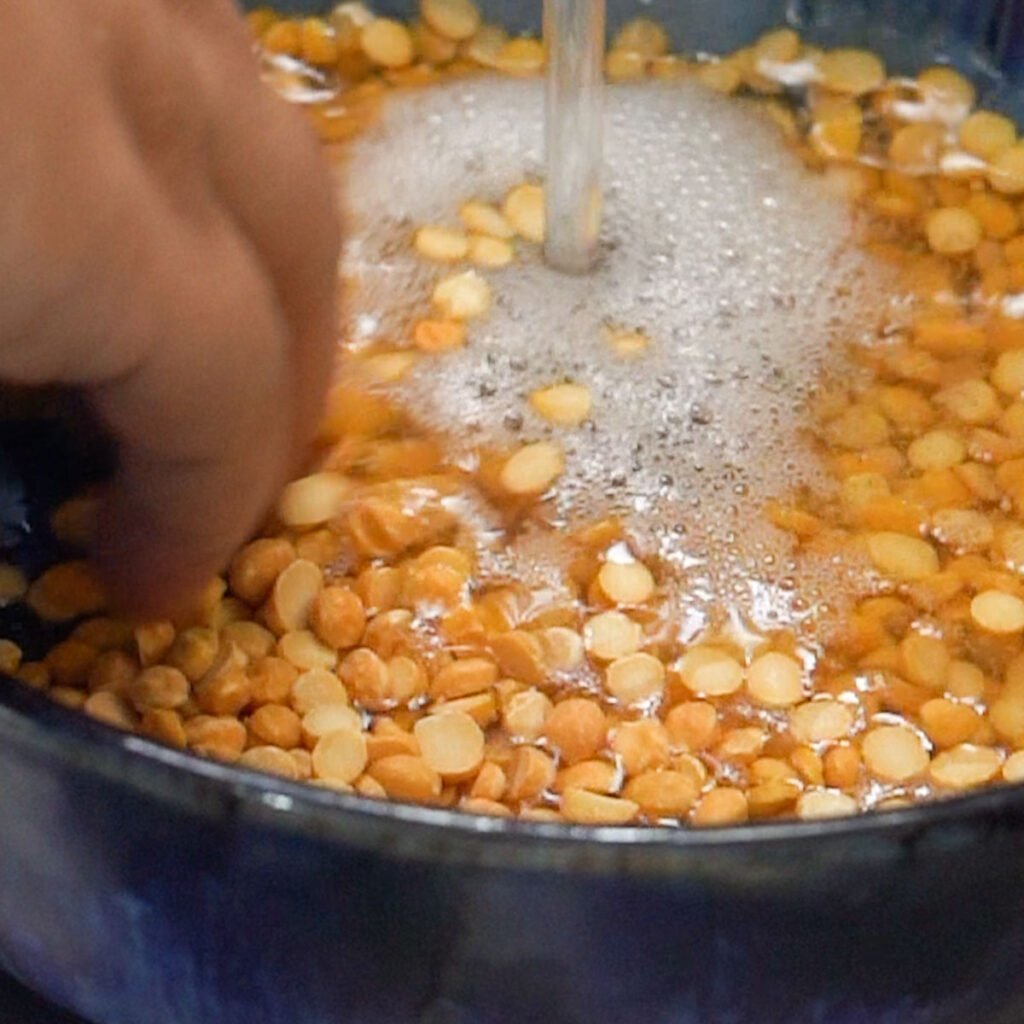 Chana Dal being washed before cooking