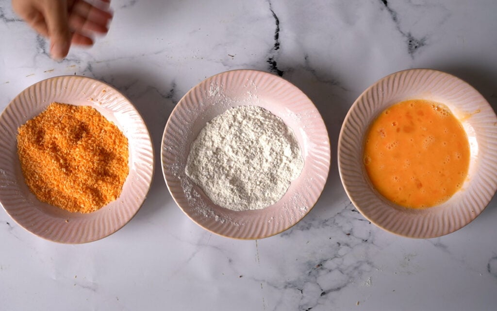 3 bowls with bread crumbs, flour and eggs