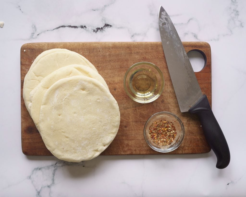 ingredients for pita chips-  pita pockets, oil and seasoning