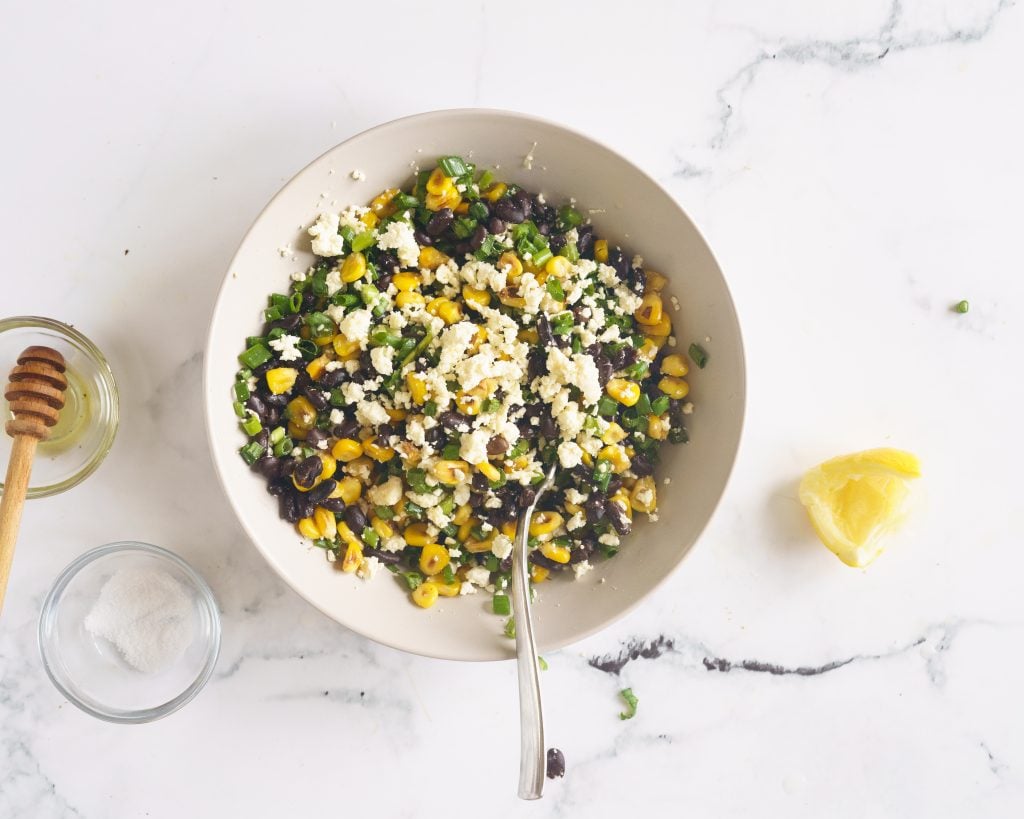 Black bean corn and feta dip in a grey bowl