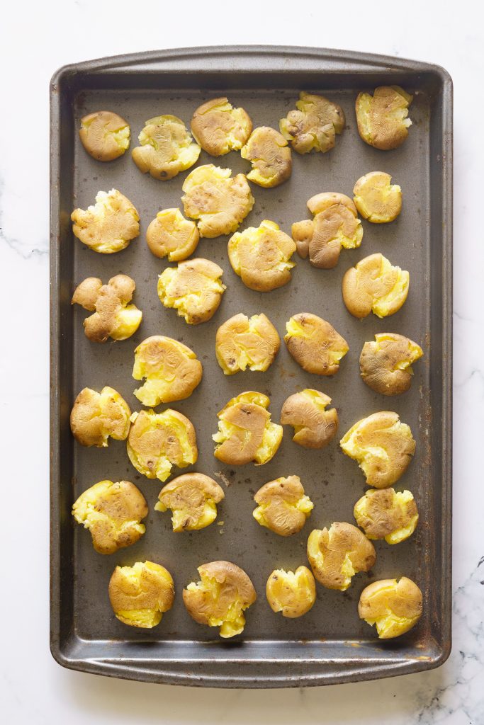 smashed potatoes on a tray