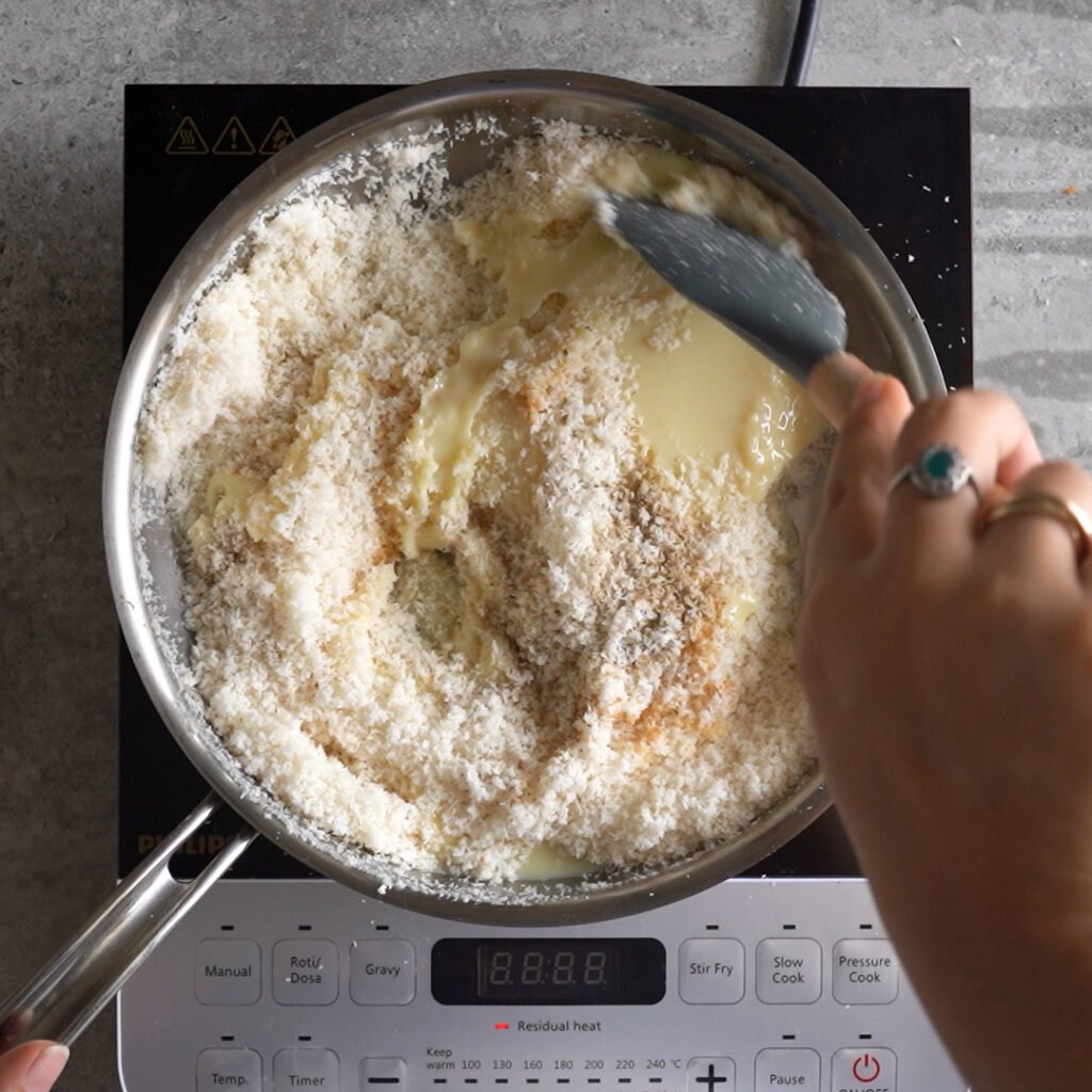 Making the ladoo mixture for  Coconut Ladoo