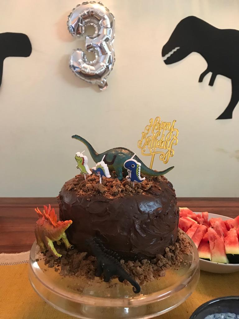 Birthday cake made with Eggless Chocolate cake.Decorated with Ganache and Dinasaurs