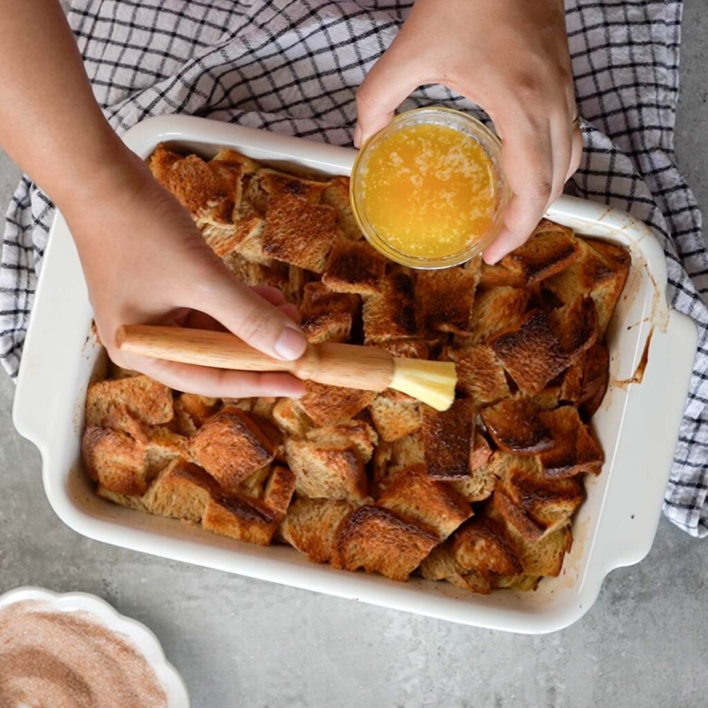 Brushing butter over the french toast