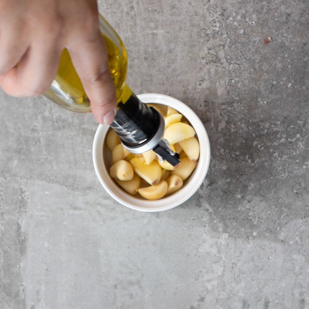 Peeled cloves in a ramekin