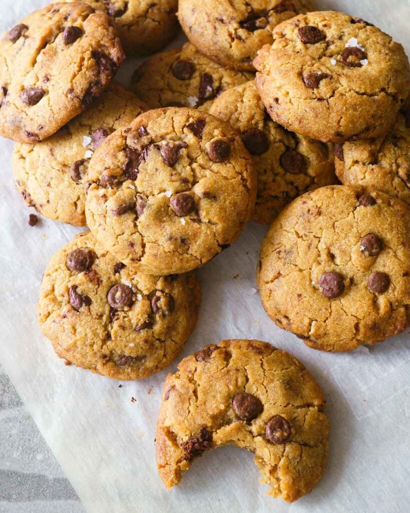 a lot of Chocolate Chip cookies on a baking paper