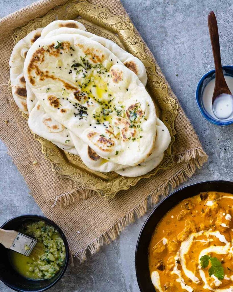 Butter garlic naan served with butter chicken