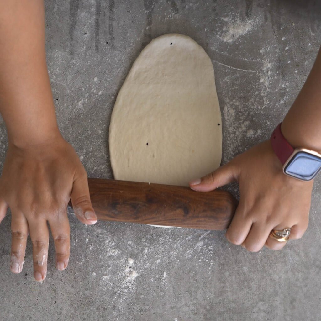 rolling the Naan dough