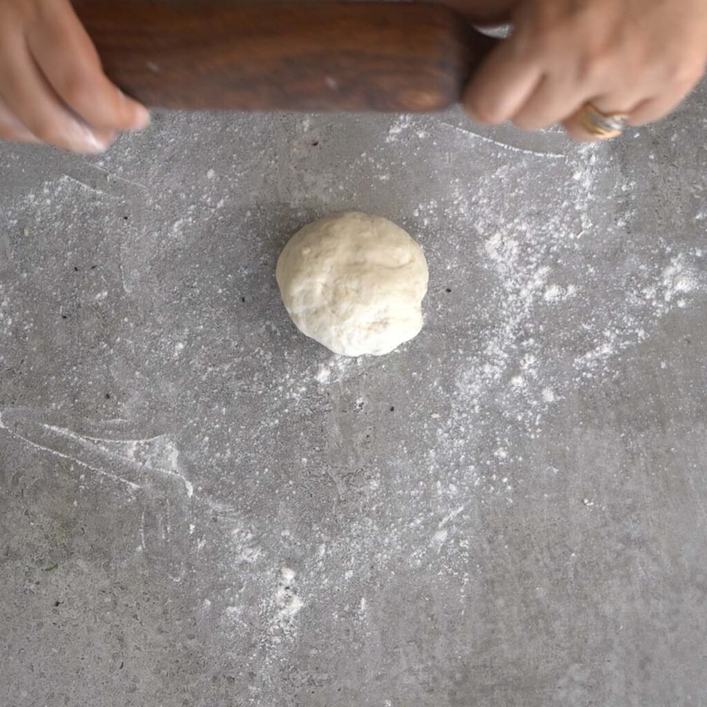 rolling the Naan dough