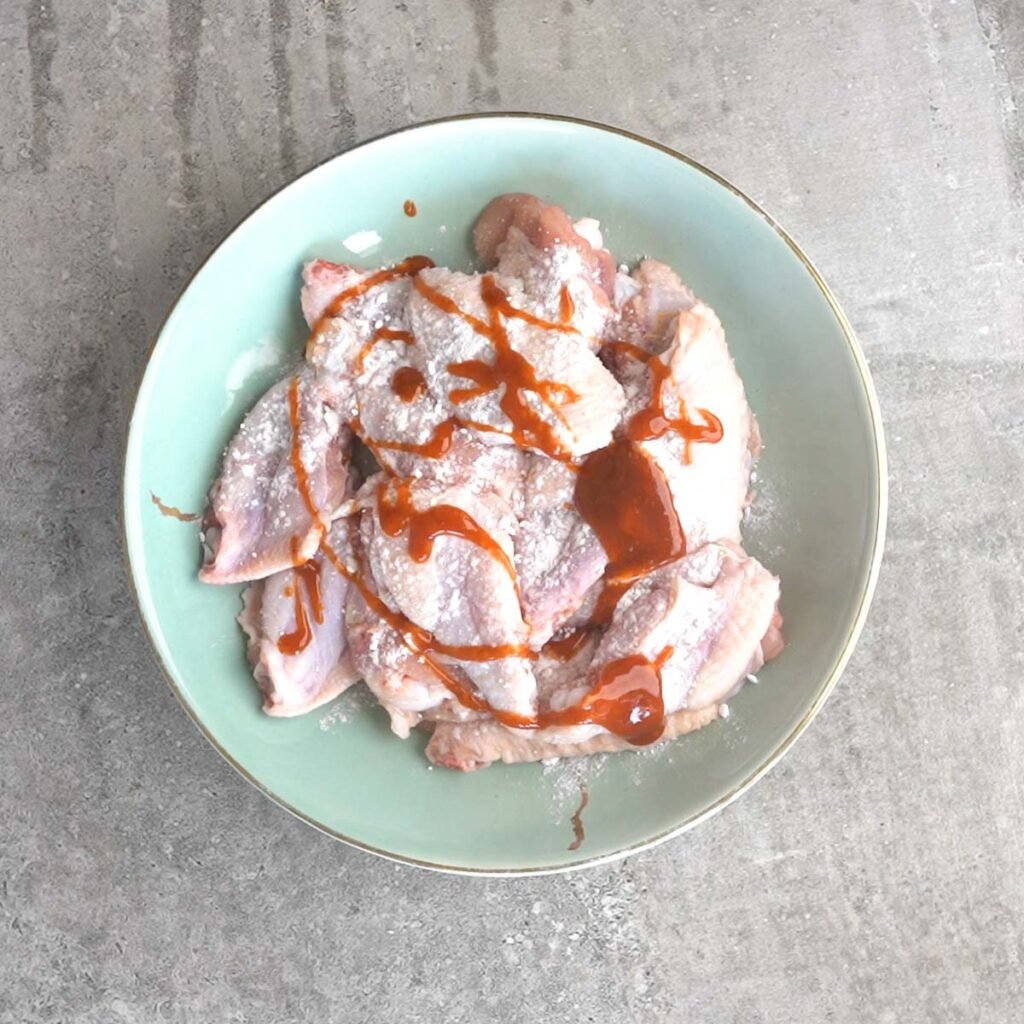 Chicken wings with little bbq sauce, baking powder and salt