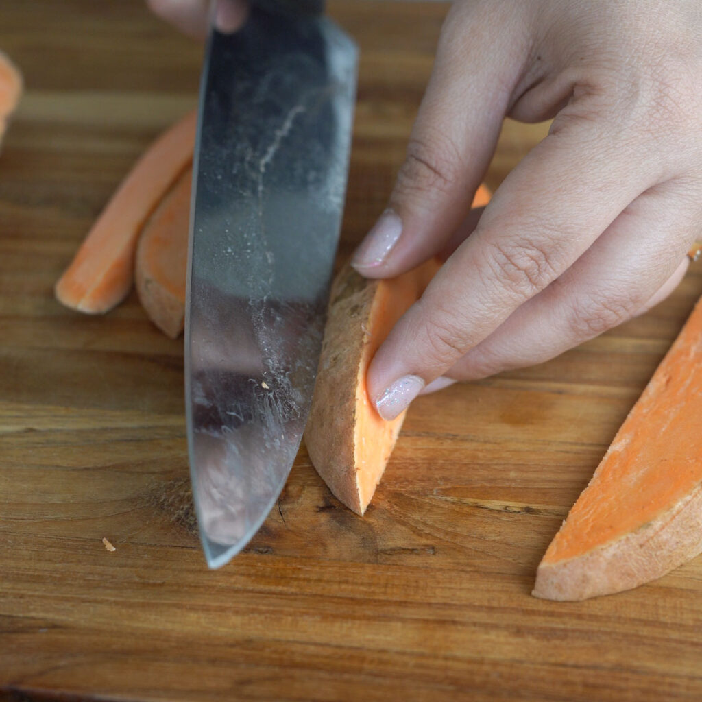 cutting sweet potato wedges