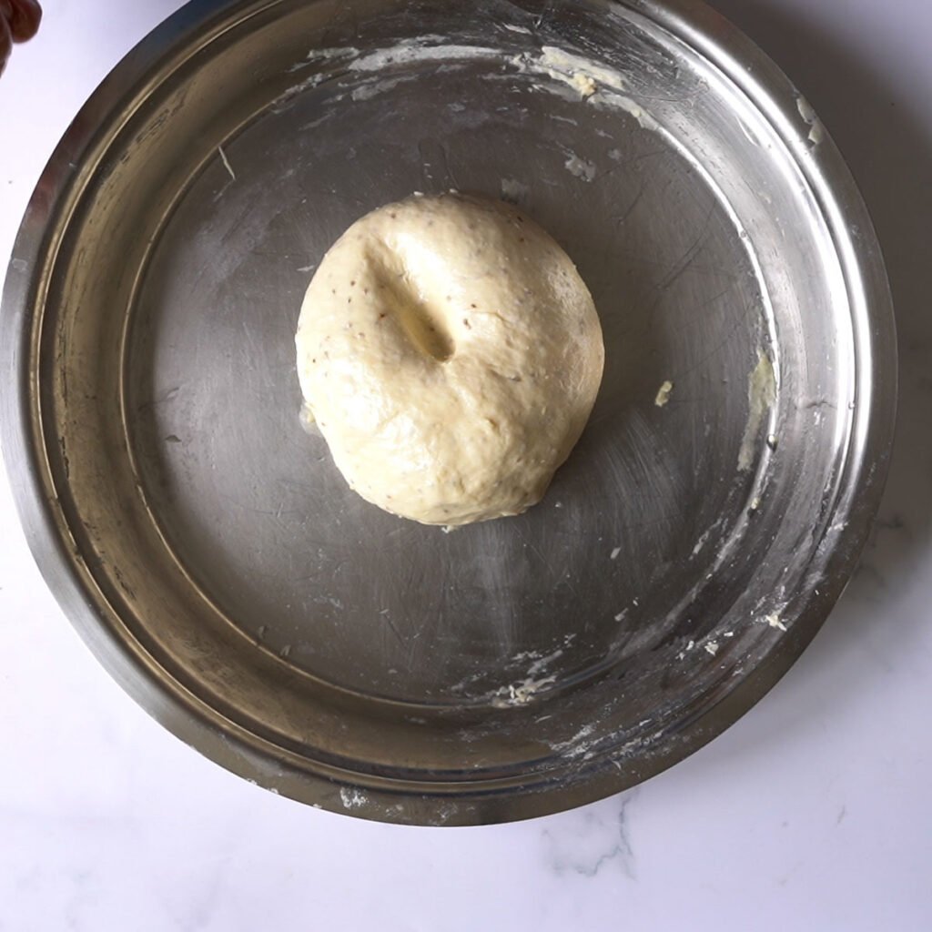 Soft bhatura dough in a steel platter