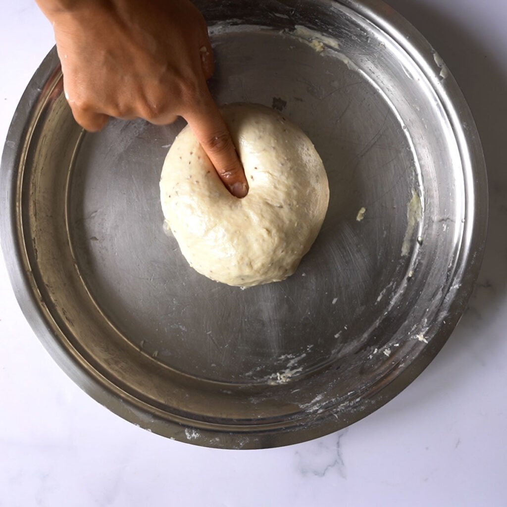 Soft bhatura dough in a steel platter