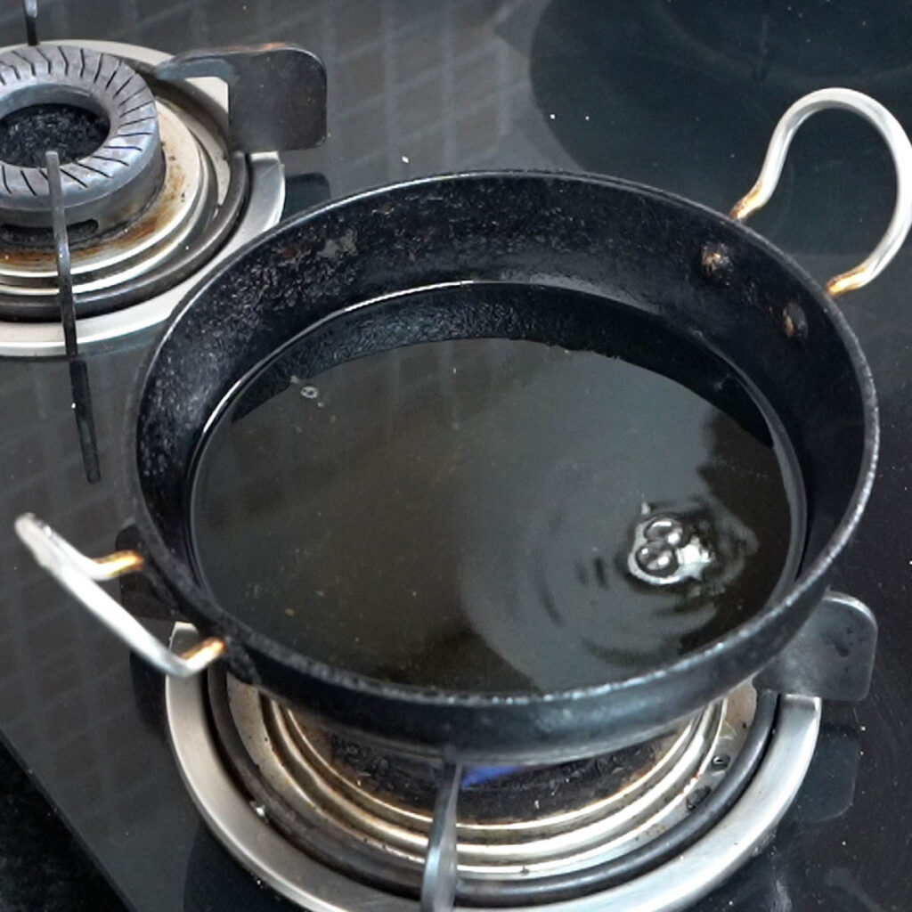 Black wok with oil