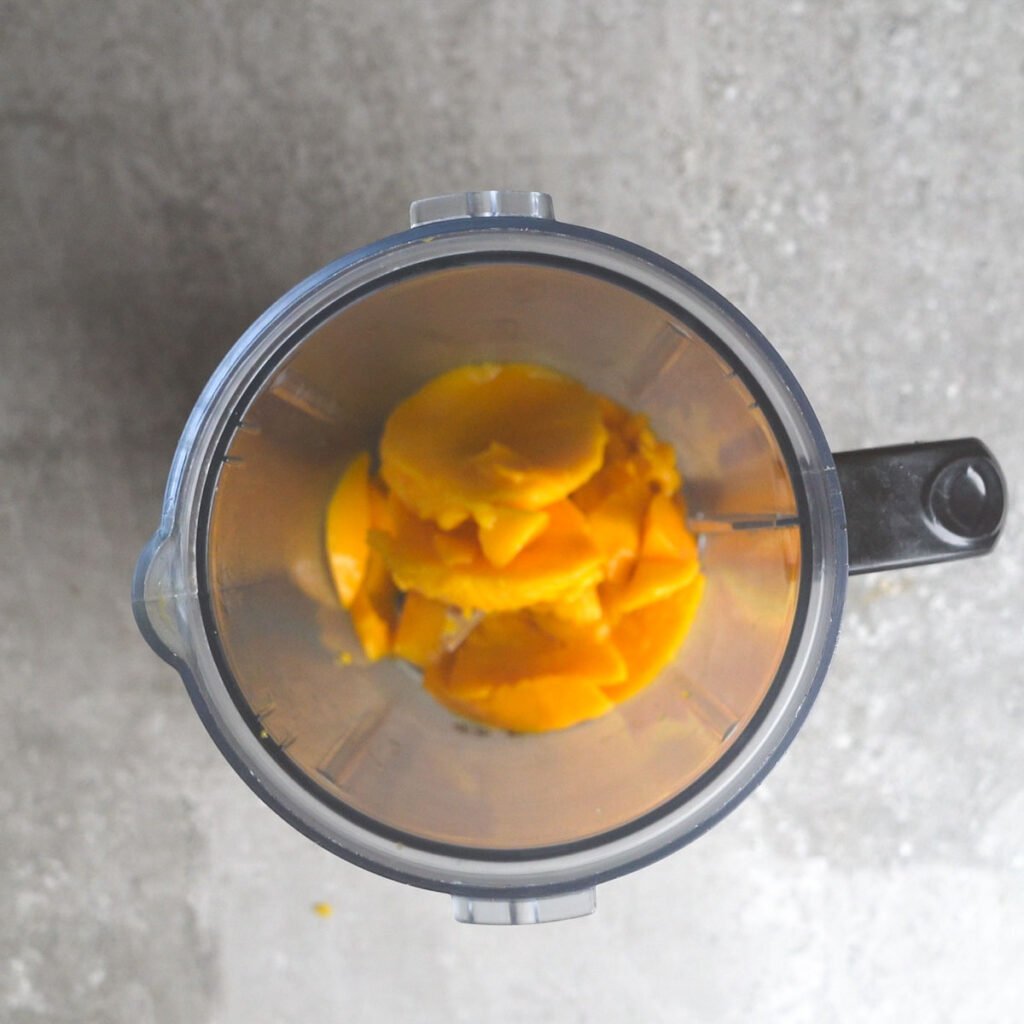 Mango cubes in a blender