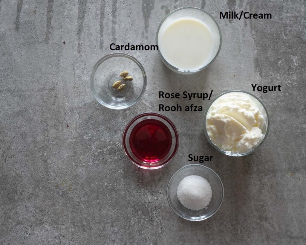 Ingredients needed to make Rose LAssi
Yogurt
Milk or Cream
Rose Syrup OR Rose Water. Read details Below
Cardamom Powder