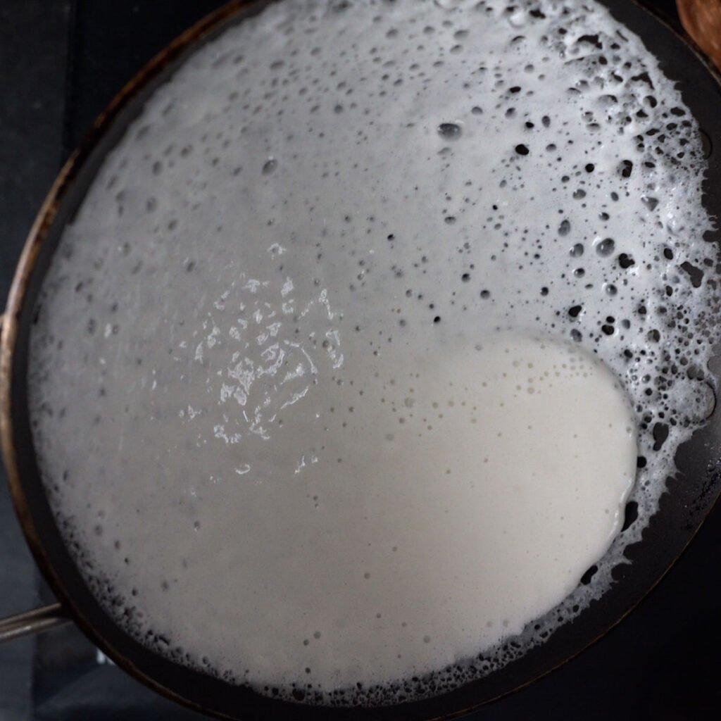 swirling appam batter to make appams