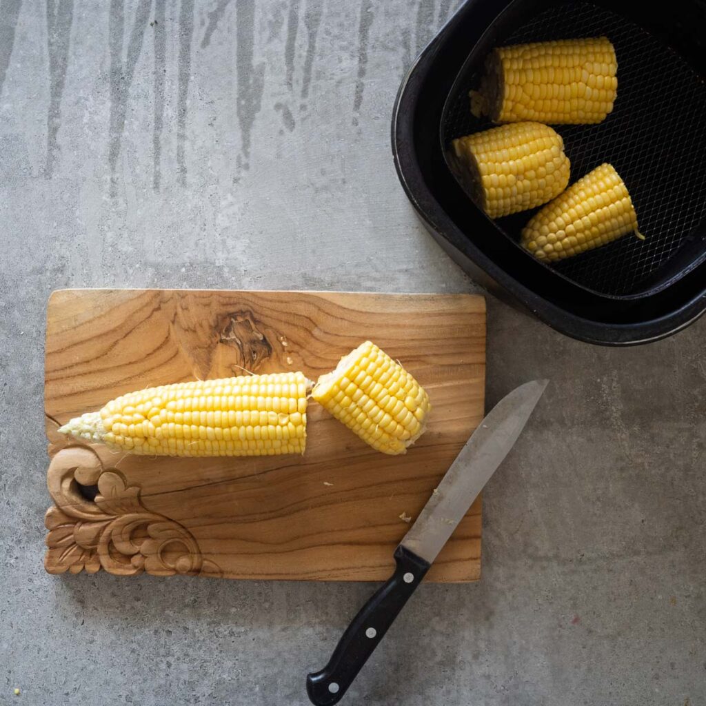 Cut the corn on the cob on a cutting board