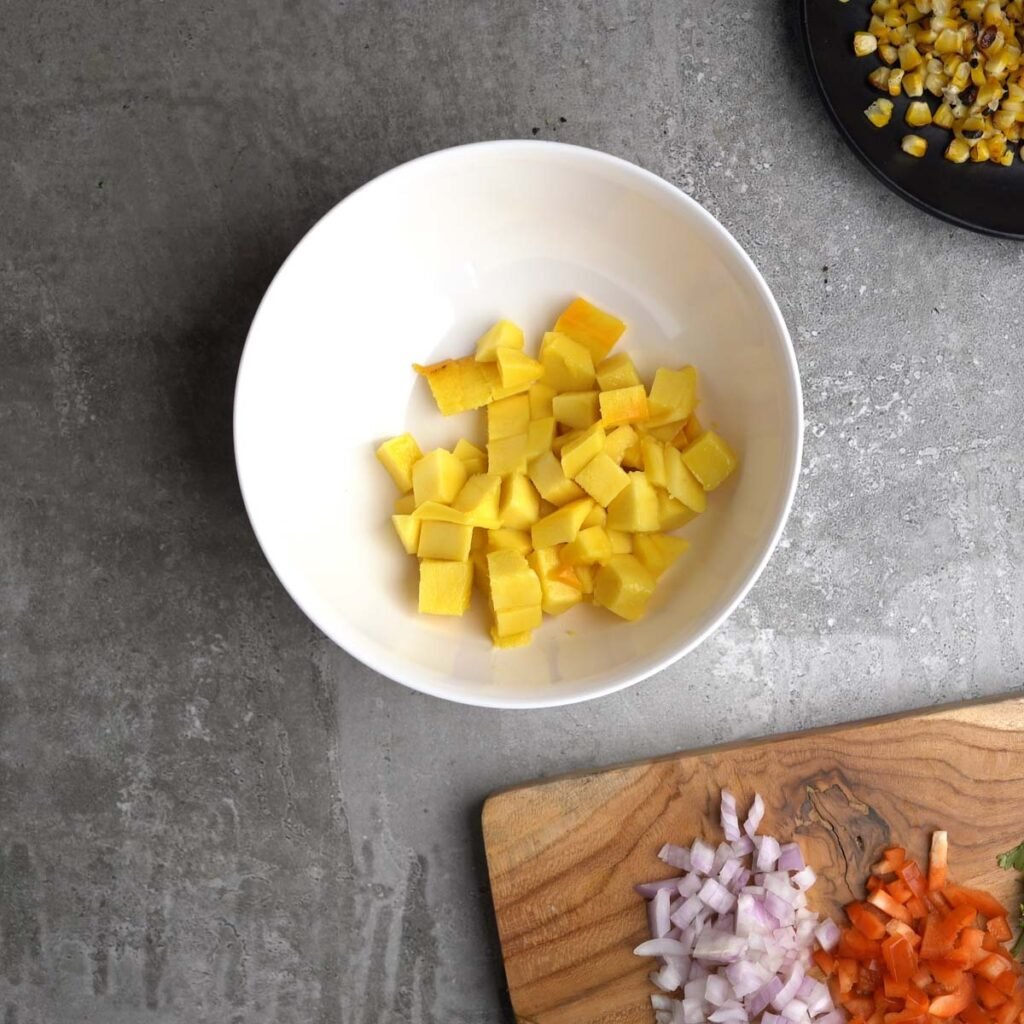 Diced up Mango in a white bowl