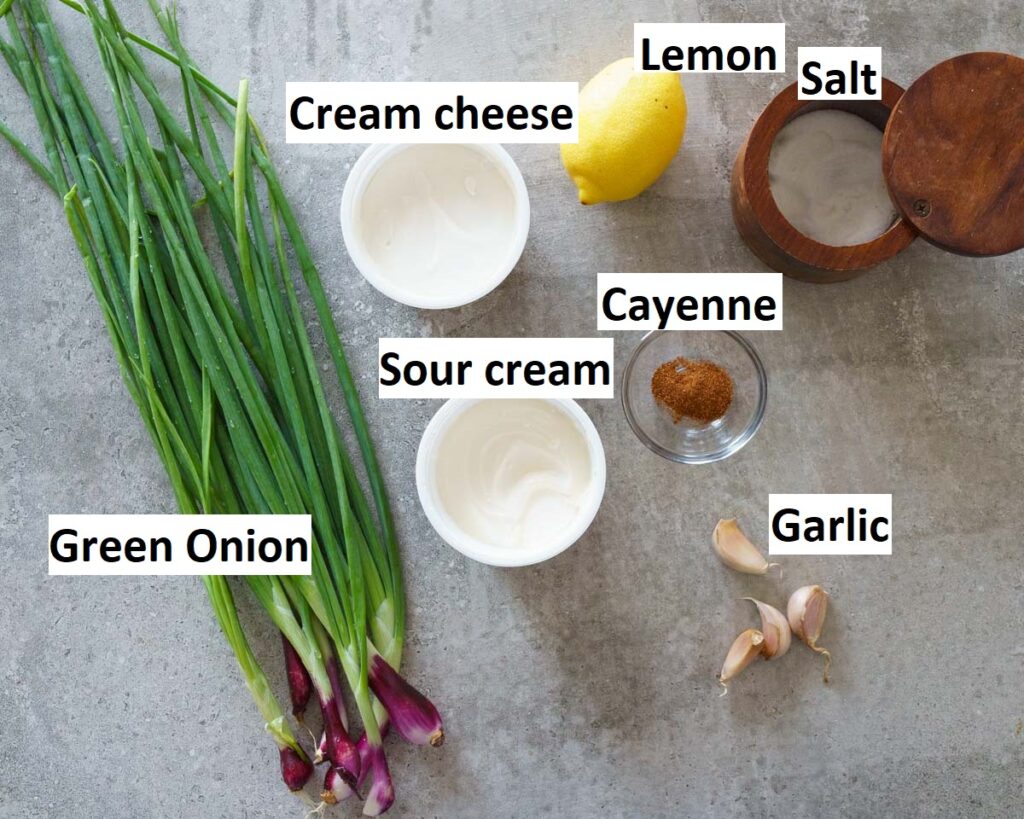 Ingredients needed to make green onion dip- green onions, sour cream, cayenne pepper, garlic, salt, cream cheese and lemon