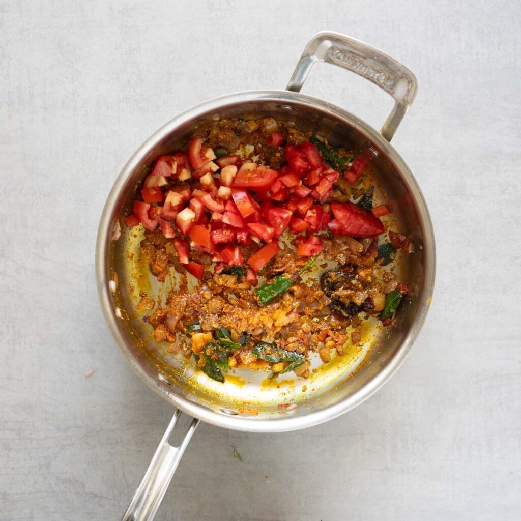 Cuisinart steel pan with onions, tomatoes and spices