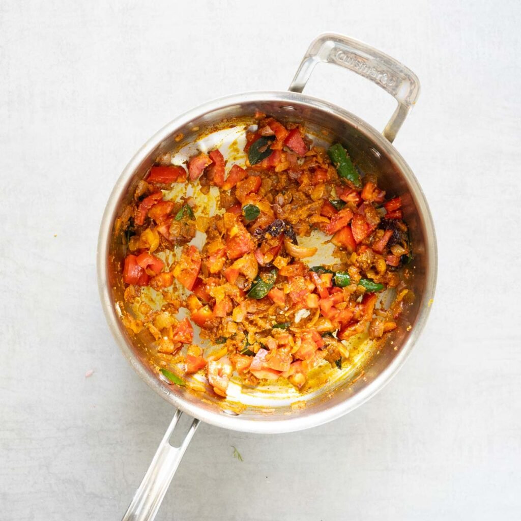 Cuisinart steel pan with onions, tomatoes and spices