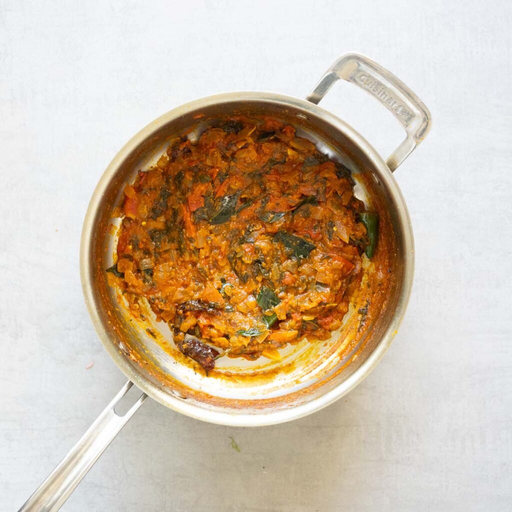 Base sauce of the gongura chicken curry in a steel pan