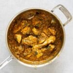 Gongura chicken curry in a steel pan