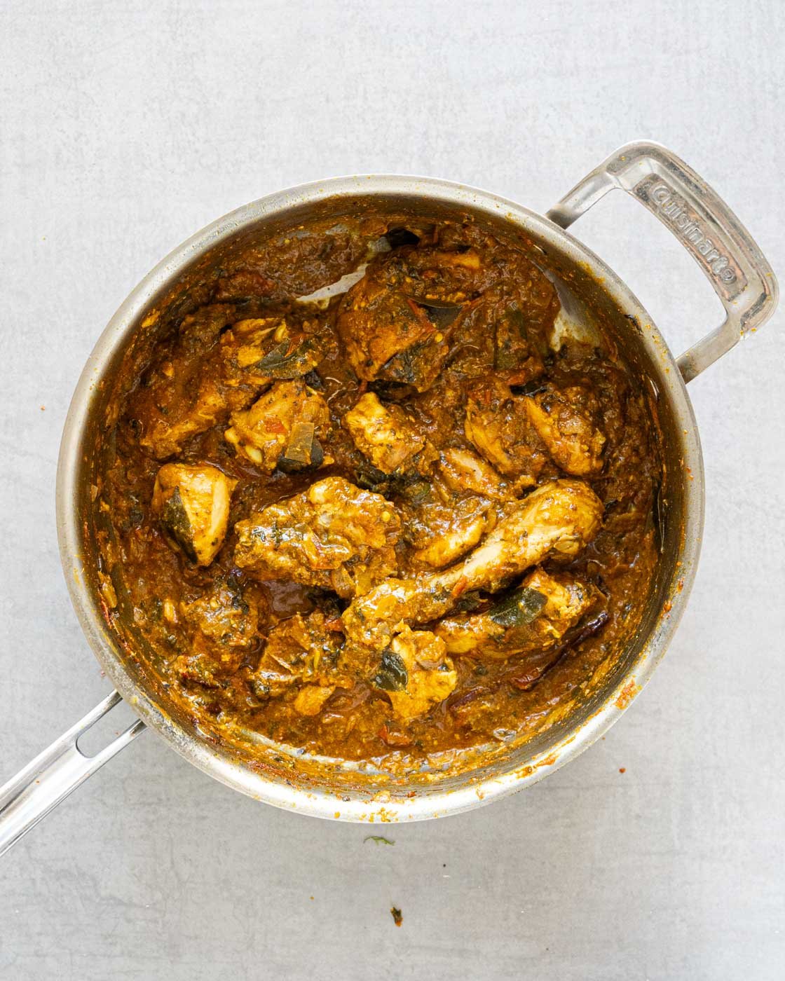 Gongura chicken curry in a steel pan