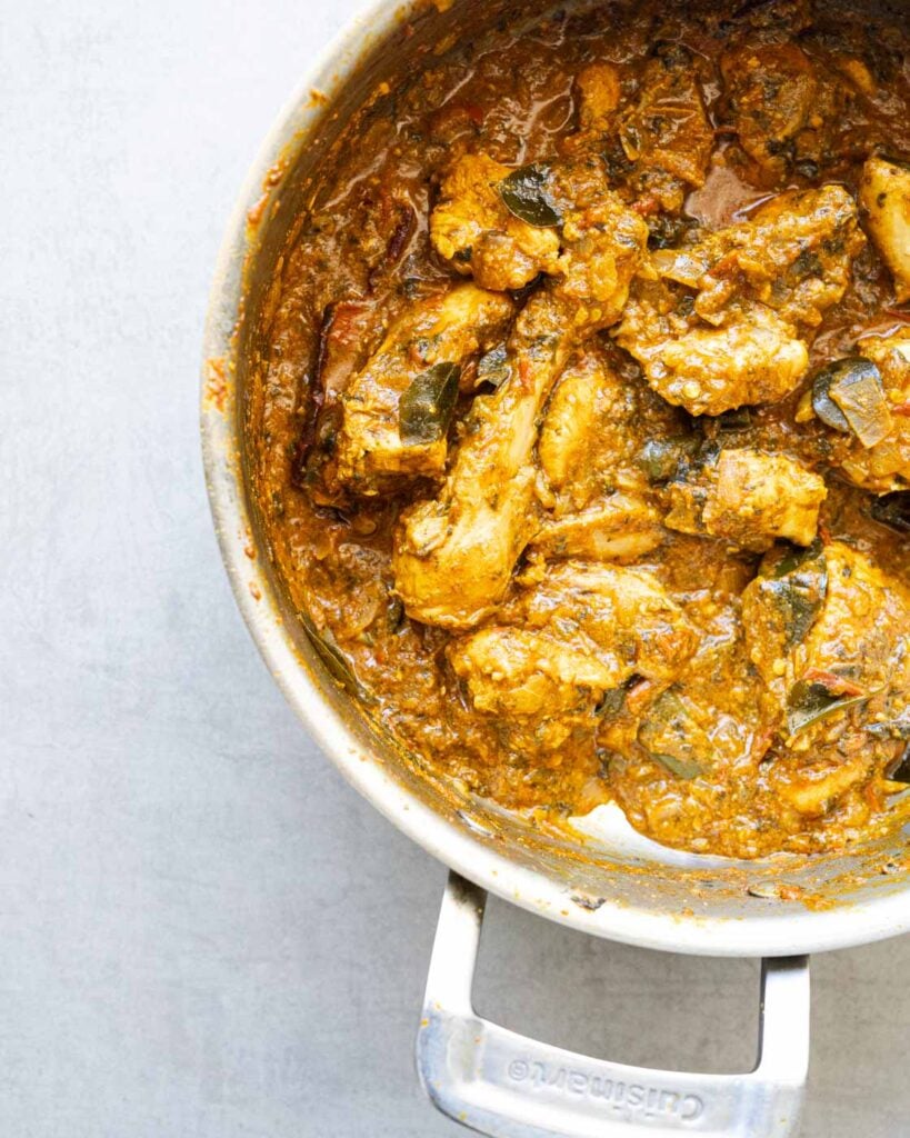 Shot of cooked gongura chicken curry in a steel pan