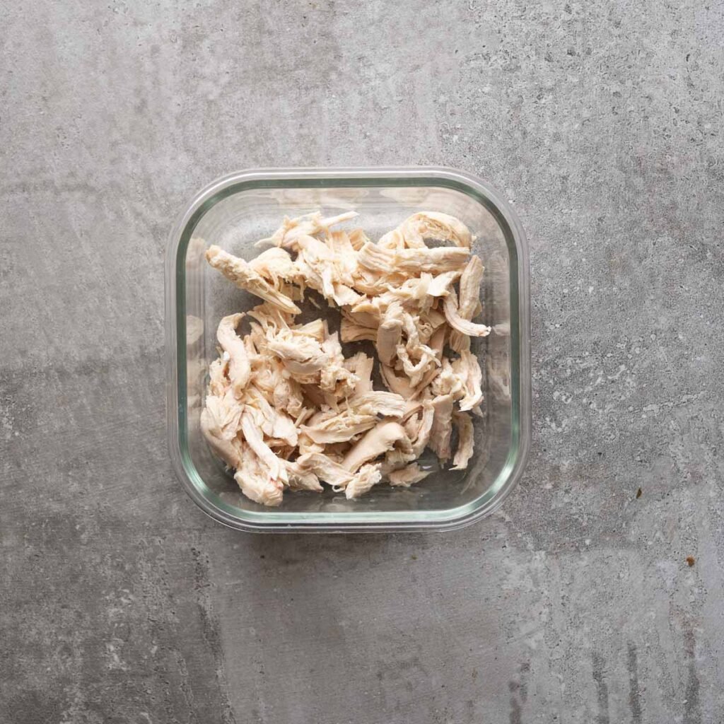 Shredded chicken in a square bowl