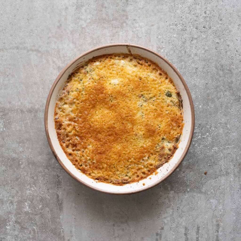 Baked jalapeno chicken poper dip with a golden top