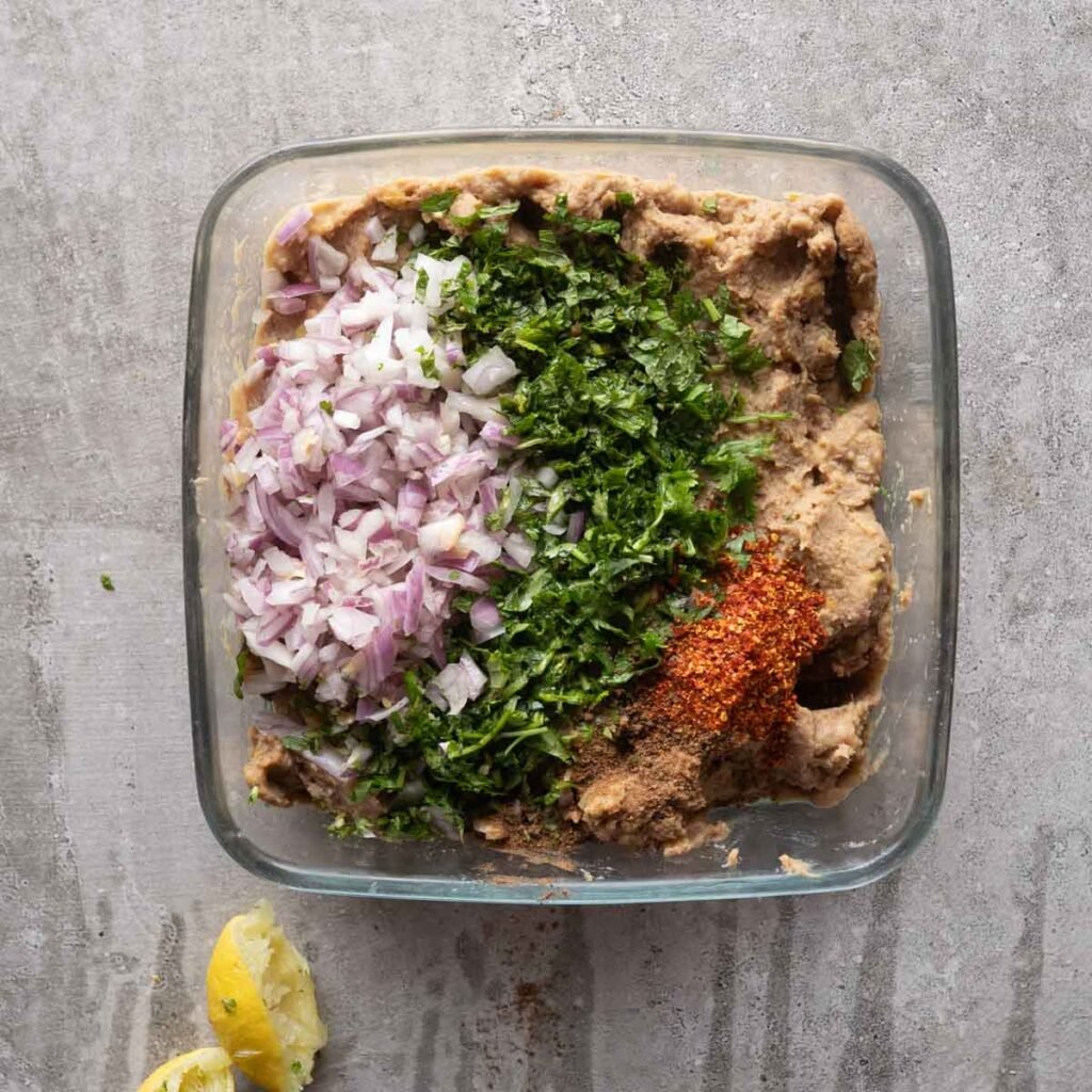 Ground mutton and dal, topped with raw onions, chili powder, mint and coriander leaves