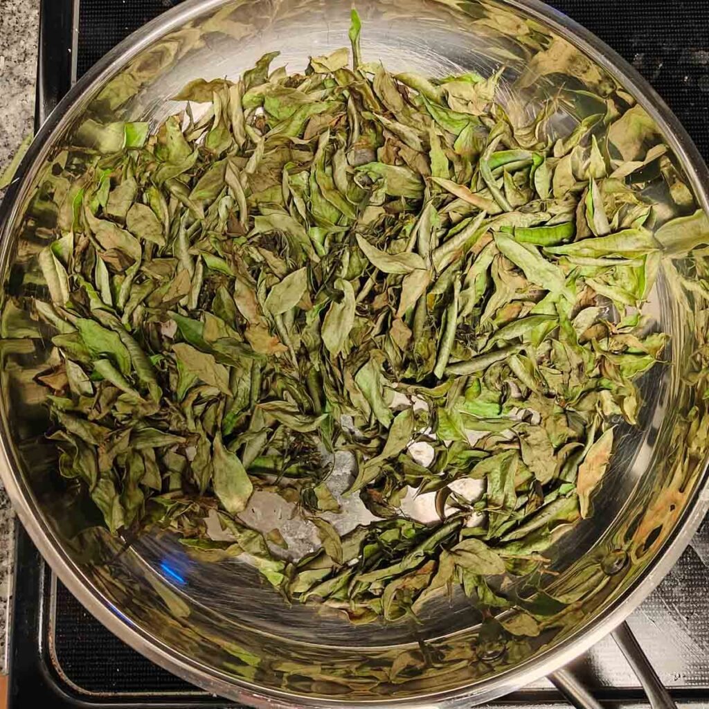 dry roasted curry leaves on a pan